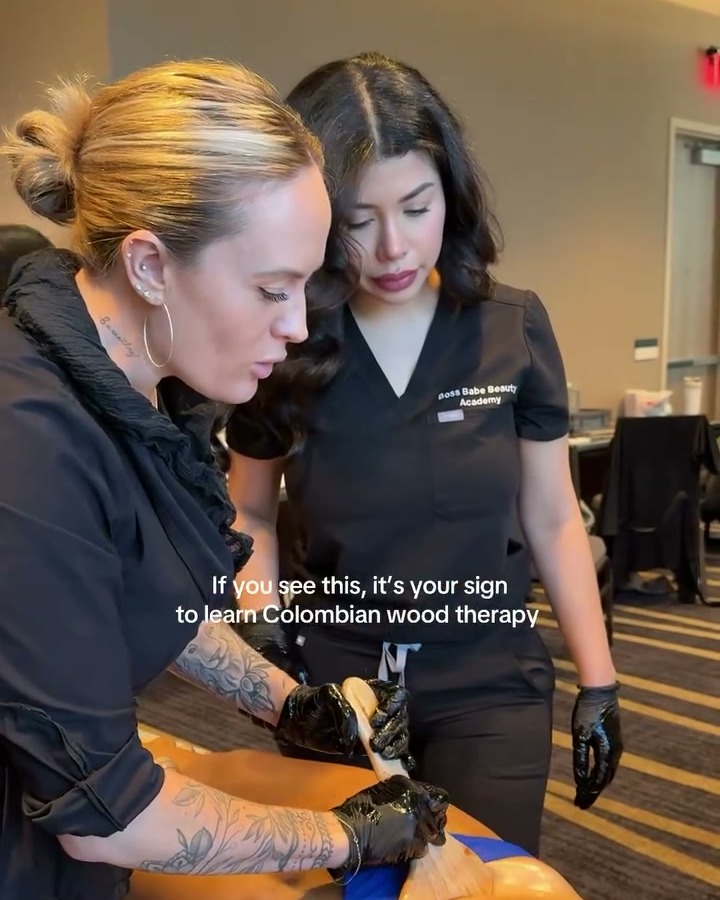 Boss Babe Beauty instructors demonstrating Colombian wood therapy on a client